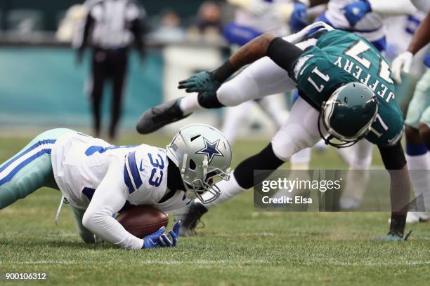 Cornerback Chidobe Awuzie of the Dallas Cowboys picks off a pass intended for wide receiver Alshon Jeffery of the Philadelphia Eagles during the...