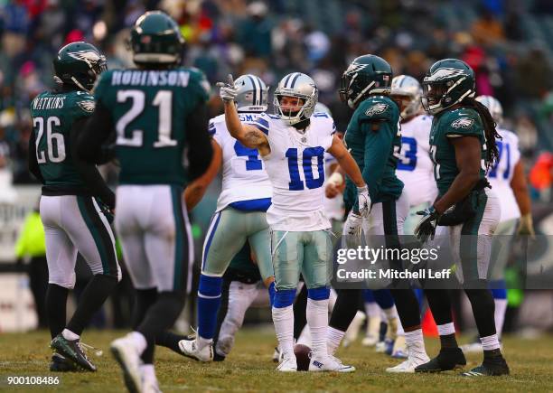 Wide receiver Ryan Switzer of the Dallas Cowboys points for a first-down after catching a pass on a third-down against the Philadelphia Eagles during...