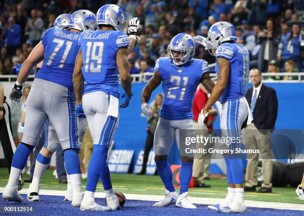 Ameer Abdullah of the Detroit Lions celebrates his touchdown against the Green Bay Packers during the fourth quarter at Ford Field on December 31,...