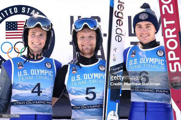 Kevin Bickner#4 Michael Glasder and William Rhoads pose on the medals podium after the U.S. Men's Ski Jumping Olympic Trials on December 31, 2017 at...