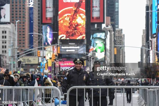 Members of the New York City police department patrol in Times Square ahead of the New Year's Eve celebration on December 31, 2017 in New York City.