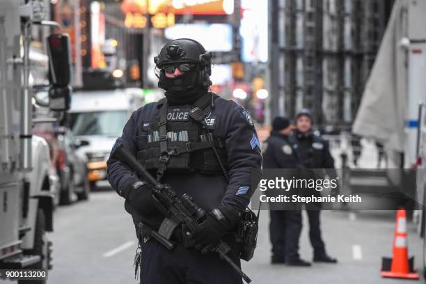 Members of the New York City police department patrol in Times Square ahead of the New Year's Eve celebration on December 31, 2017 in New York City.