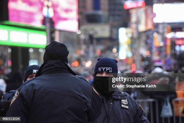 Members of the New York City police department patrol in Times Square ahead of the New Year's Eve celebration on December 31, 2017 in New York City.