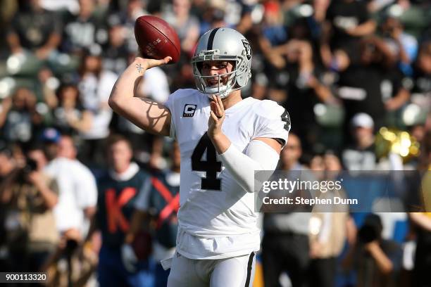 Derek Carr of the Oakland Raiders throws a pass in the first quarter during the game against the Los Angeles Chargers at StubHub Center on December...