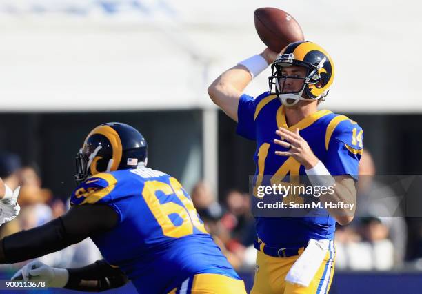 Jamon Brown blocks for Sean Mannion of the Los Angeles Rams as he passes the ball during the first half of a game against the San Francisco 49ers at...