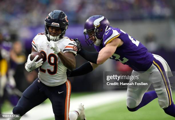 Tarik Cohen of the Chicago Bears breaks a tackle by Harrison Smith of the Minnesota Vikings in the fourth quarter of the game on December 31, 2017 at...
