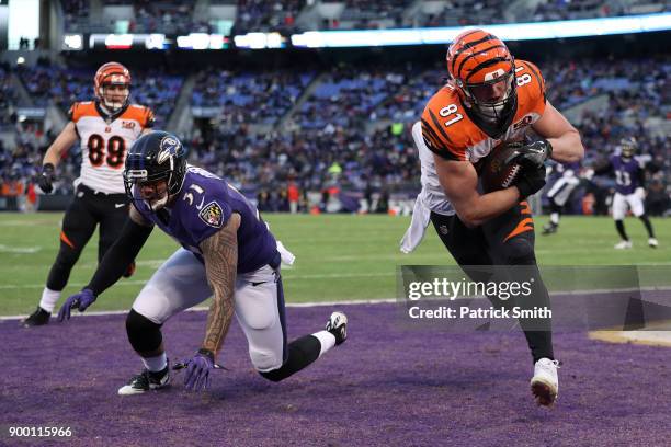 Tight End Tyler Kroft of the Cincinnati Bengals catches a touchdown in the first quarter against Kamalei Correa of the Baltimore Ravens at M&T Bank...
