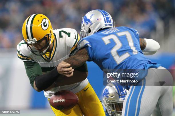 Green Bay Packers quarterback Brett Hundley loses control of the ball after a hit by Detroit Lions free safety Glover Quin during the first half of...