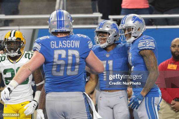 Detroit Lions wide receiver Marvin Jones celebrates his touchdown with teammates during the first half of an NFL football game against the Green Bay...