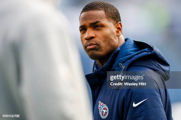 Injured Running Back DeMarco Murray of the Tennessee Titans looks on as the team warms up before there game against the Jacksonville Jaguars at...