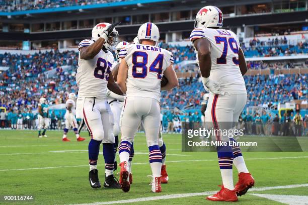 Nick O'Leary of the Buffalo Bills celebrating with teammates after scoring a touchdown during the first quarter against the Miami Dolphins at Hard...