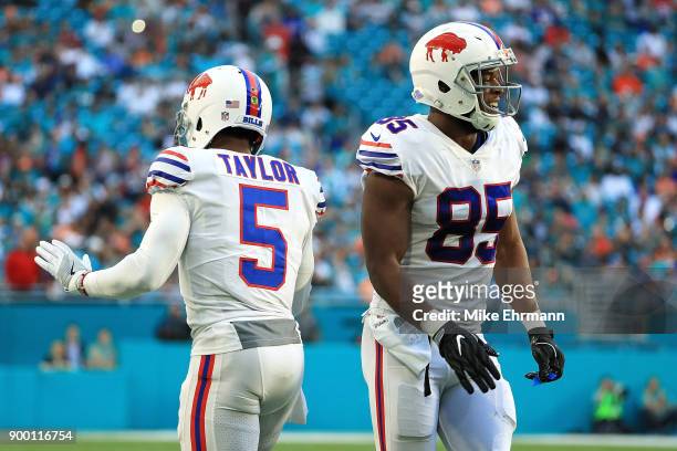 Tyrod Taylor and Charles Clay of the Buffalo Bills during the first quarter against the Miami Dolphins at Hard Rock Stadium on December 31, 2017 in...