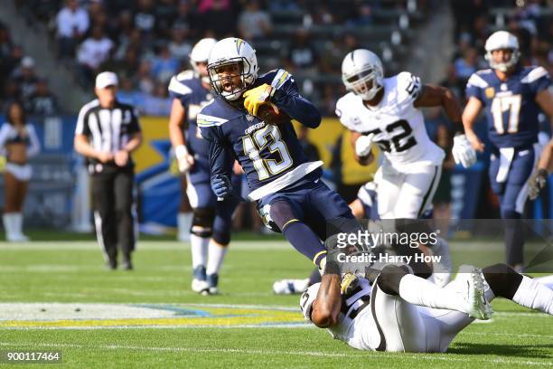 Keenan Allen of the Los Angeles Chargers makes the catch for a first down as he is being tackled by NaVorro Bowman of the Oakland Raiders during the...