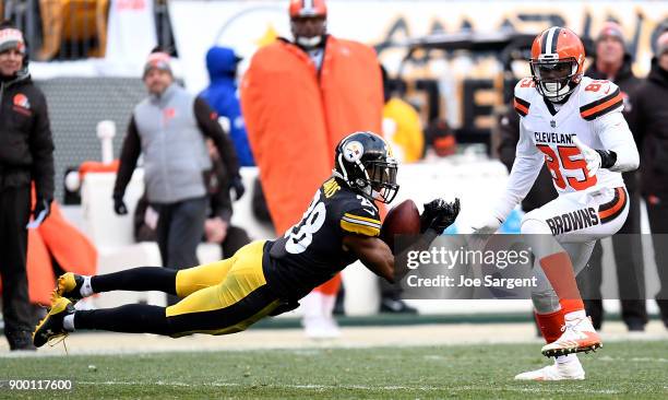 Sean Davis of the Pittsburgh Steelers intercepts a pass in front of David Njoku of the Cleveland Browns in the second half during the game at Heinz...