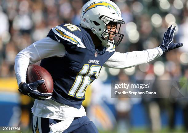 Tyrell Williams of the Los Angeles Chargers rushes the ball to try and gain extra yardage during the first half of the game against the Oakland...