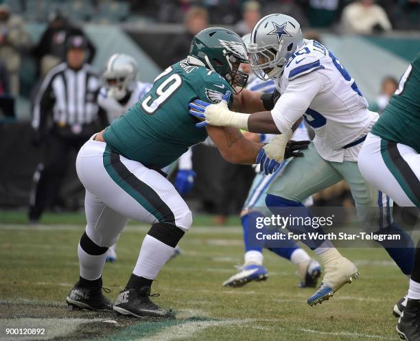 Dallas Cowboys defensive end DeMarcus Lawrence takes on Philadelphia Eagles guard Brandon Brooks during the first half at Lincoln Financial Field in...