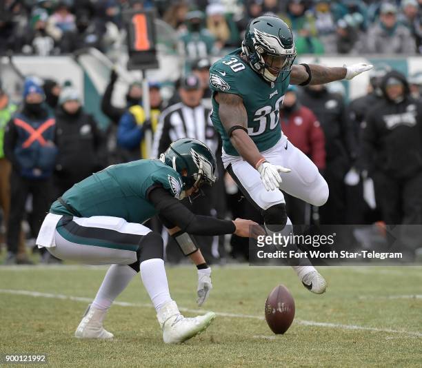 Dallas Cowboys wide receiver Dez Bryant trying to stay warm on the sidelines against the Philadelphia Eagles at Lincoln Financial Field in...