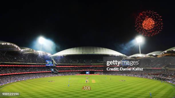 General view of play as fireworks can be seen for new year's eve celebrations during the Big Bash League match between the Adelaide Strikers and the...