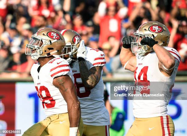 Carlos Hyde of the San Francisco 49ers celebrates his touchdown with Louis Murphy and Kyle Juszczyk against Los Angeles Rams during the second...