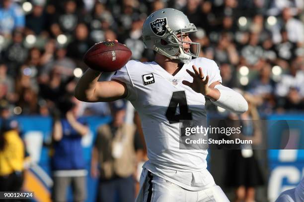 Derek Carr of the Oakland Raiders throws a pass during the first half of the game against the Los Angeles Chargers at StubHub Center on December 31,...