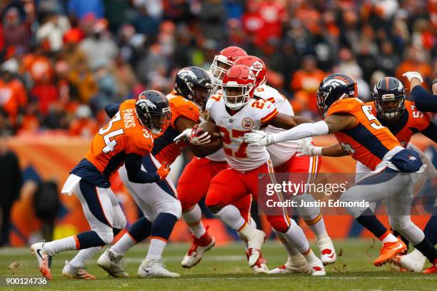 Running back Kareem Hunt of the Kansas City Chiefs breaks away from inside linebacker Brandon Marshall of the Denver Broncos on his way to running...