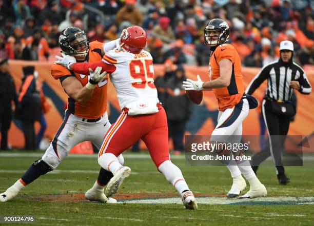 Denver Broncos quarterback Paxton Lynch looks to make a throw during the second quarter against the Kansas City Chiefs on December 31, 2017 in...
