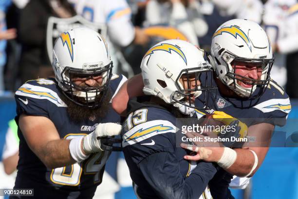 Keenan Allen of the Los Angeles Chargers, Derek Watt, and Spencer Pulley celebrate after a touchdown during the first half of the game against the...