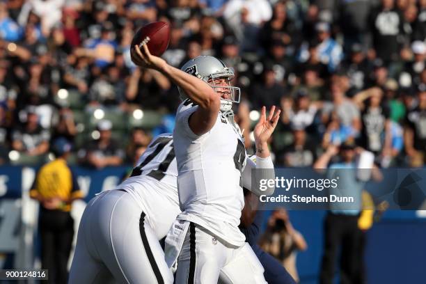 Derek Carr of the Oakland Raiders throws a pass during the first half of the game against the Los Angeles Chargers at StubHub Center on December 31,...