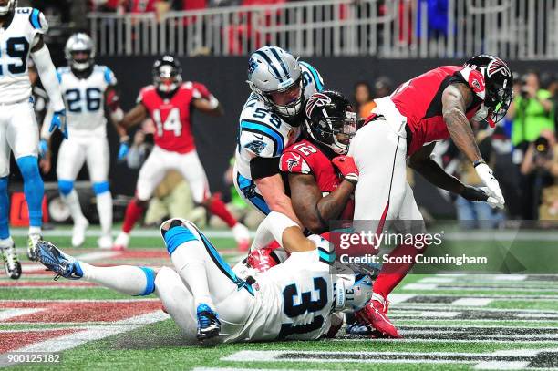 Mohamed Sanu of the Atlanta Falcons fails to make a catch for a touchdown during the second half against the Carolina Panthers at Mercedes-Benz...