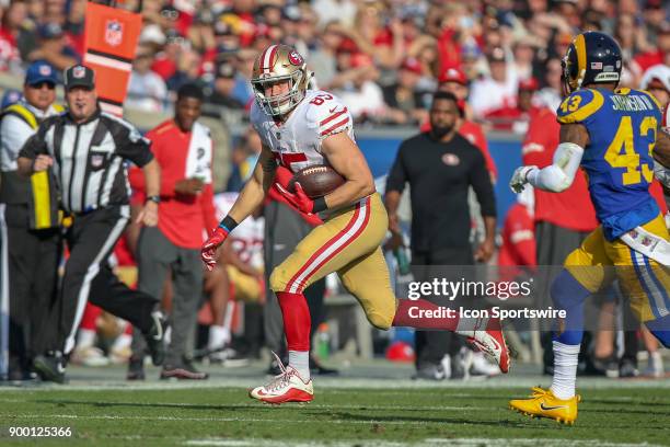 George Kittle of the San Francisco 49ers runs for a gain during an NFL game between the game between the San Francisco 49ers and the Los Angeles Rams...