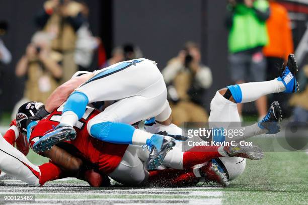 Mohamed Sanu of the Atlanta Falcons fails to pull in a reception for a touchdown during the second half against the Carolina Panthers at...