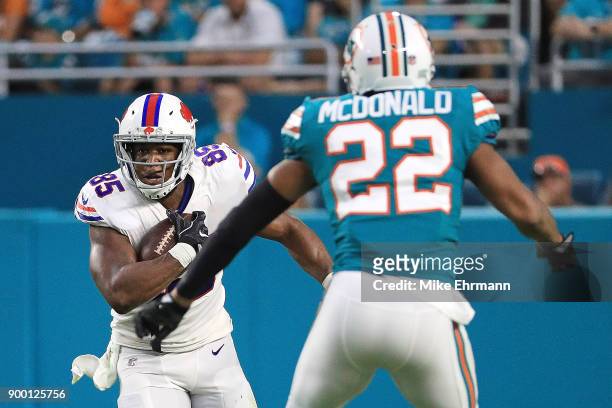 Charles Clay of the Buffalo Bills carries the ball during the second quarter against the Miami Dolphins at Hard Rock Stadium on December 31, 2017 in...
