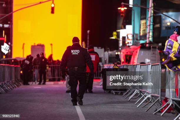 Members of the New York City police department patrol in Times Square ahead of the New Year's Eve celebration on December 31, 2017 in New York City.