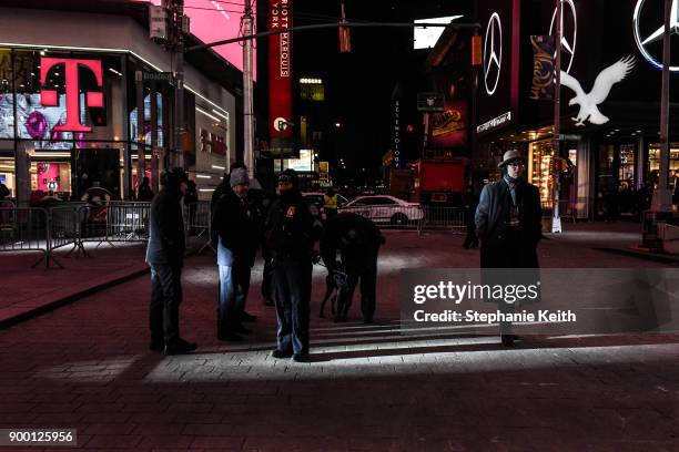 Members of the New York City police department patrol in Times Square ahead of the New Year's Eve celebration on December 31, 2017 in New York City.