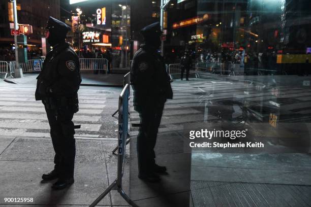 Members of the New York City police department patrol in Times Square ahead of the New Year's Eve celebration on December 31, 2017 in New York City.