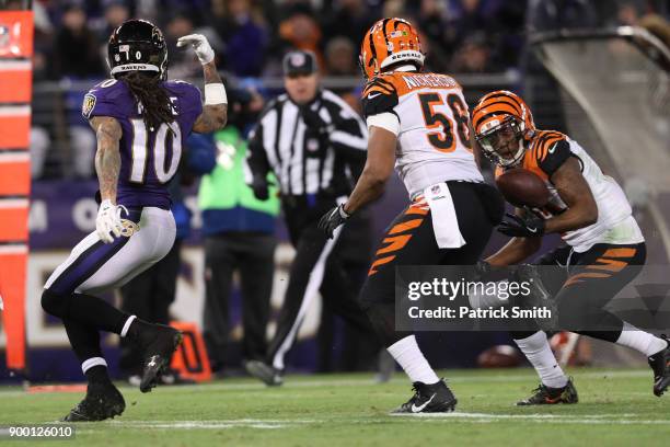 Cornerback Darqueze Dennard of the Cincinnati Bengals intercepts a pass in the third quarter against the Baltimore Ravens at M&T Bank Stadium on...