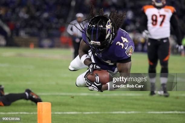 Running back Alex Collins of the Baltimore Ravens dives for a touchdown in the third quarter against the Cincinnati Bengals at M&T Bank Stadium on...