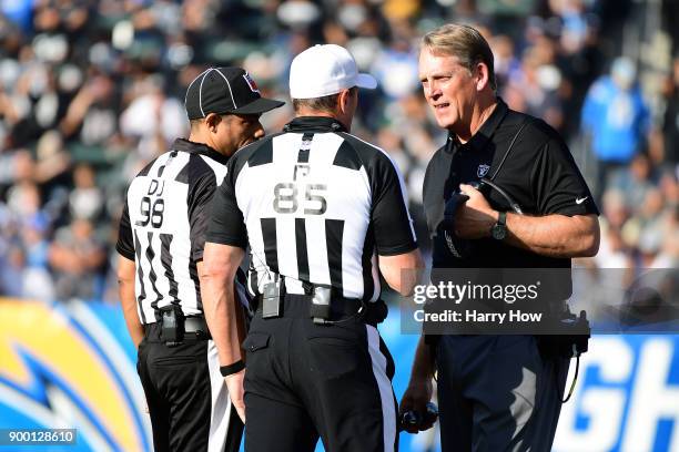 Head Coach Jack Del Rio of the Oakland Raiders argues a penalty call with the officials during the second quarter of the game against the Los Angeles...