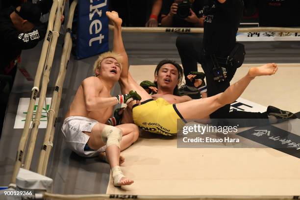 Yusuke Yachi of Japan celebrates his submission victory against Takanori Gomi of Japan in the bout during the RIZIN Fighting World Grand-Prix 2017...