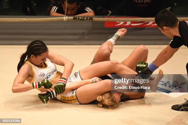 Shinju Nozawa Auclair of the United States secures an arm bar submission against Chelsea LaGrasse of the United States in the women's bout during the...