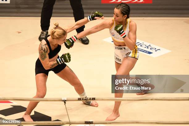 Shinju Nozawa Auclair of the United States and Chelsea LaGrasse of the United States compete in the women's bout during the RIZIN Fighting World...