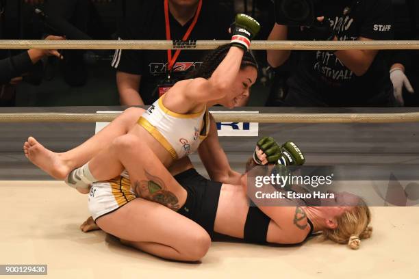 Shinju Nozawa Auclair of the United States and Chelsea LaGrasse of the United States compete in the women's bout during the RIZIN Fighting World...