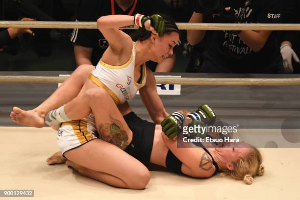 Shinju Nozawa Auclair of the United States and Chelsea LaGrasse of the United States compete in the women's bout during the RIZIN Fighting World...