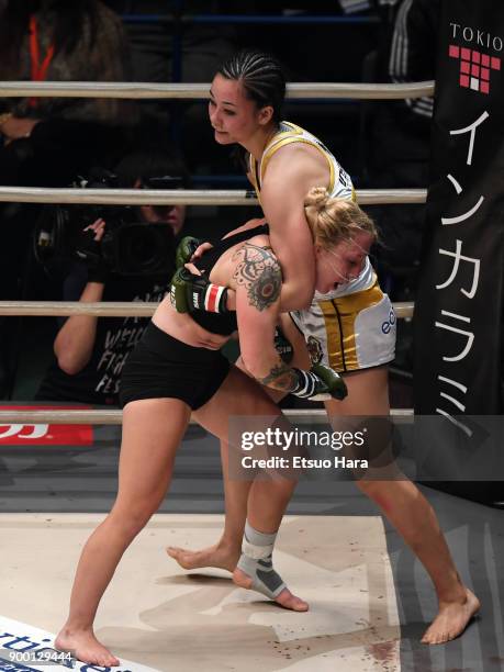 Shinju Nozawa Auclair of the United States and Chelsea LaGrasse of the United States compete in the women's bout during the RIZIN Fighting World...