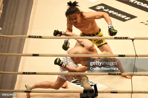 Yusuke Yachi of Japan and Takanori Gomi of Japan compete in the bout during the RIZIN Fighting World Grand-Prix 2017 final Round at Saitama Super...