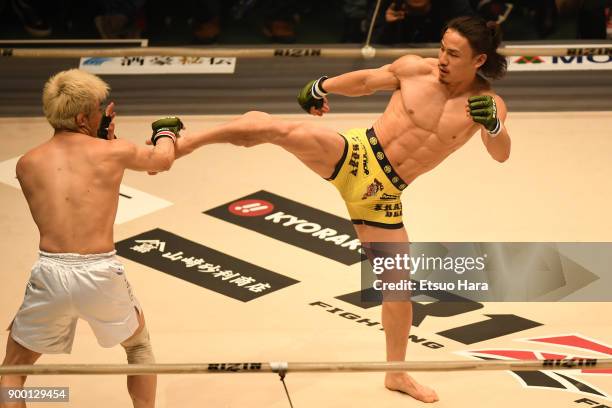 Yusuke Yachi of Japan kicks Takanori Gomi of Japan in the bout during the RIZIN Fighting World Grand-Prix 2017 final Round at Saitama Super Arena on...