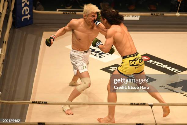 Yusuke Yachi of Japan and Takanori Gomi of Japan compete in the bout during the RIZIN Fighting World Grand-Prix 2017 final Round at Saitama Super...