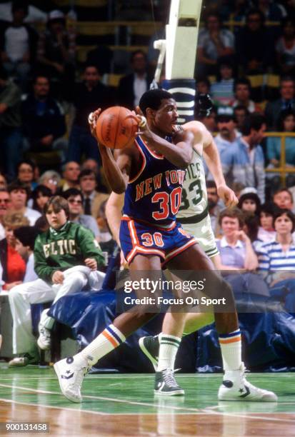 Bernard King of the New York Knicks in action against the Boston Celtics during an NBA basketball game circa 1984 at the Boston Garden in Boston,...