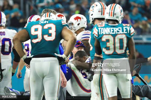 LeSean McCoy of the Buffalo Bills is carted off the field after an injury in the third quarter against the Miami Dolphins at Hard Rock Stadium on...