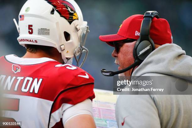 Arizona Cardinals head coach Bruce Arians talks with Drew Stanton on the sidelines during the game against the Seattle Seahawks at CenturyLink Field...